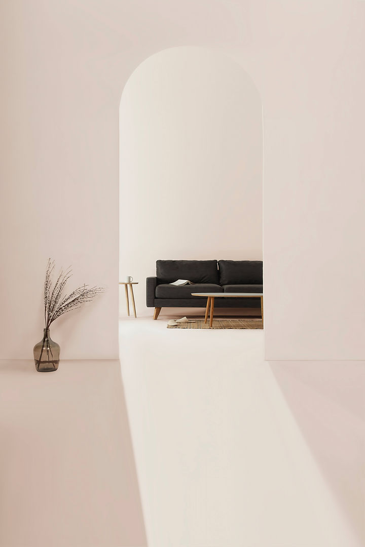 Large, dark grey sofa visible through white archway 