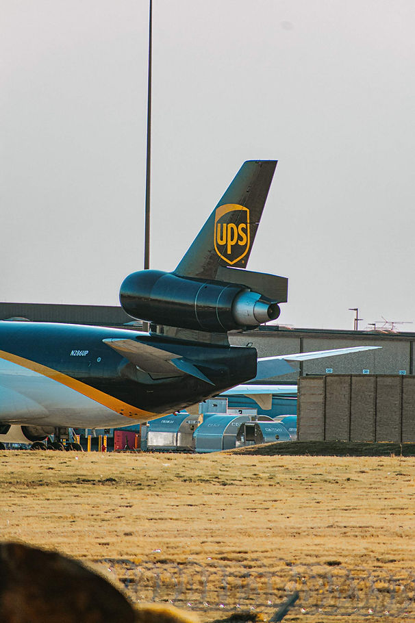 Picture of back of UPS airplane to show UPS have faster shipping services than USPS. However, UPS options can be more expensive. 