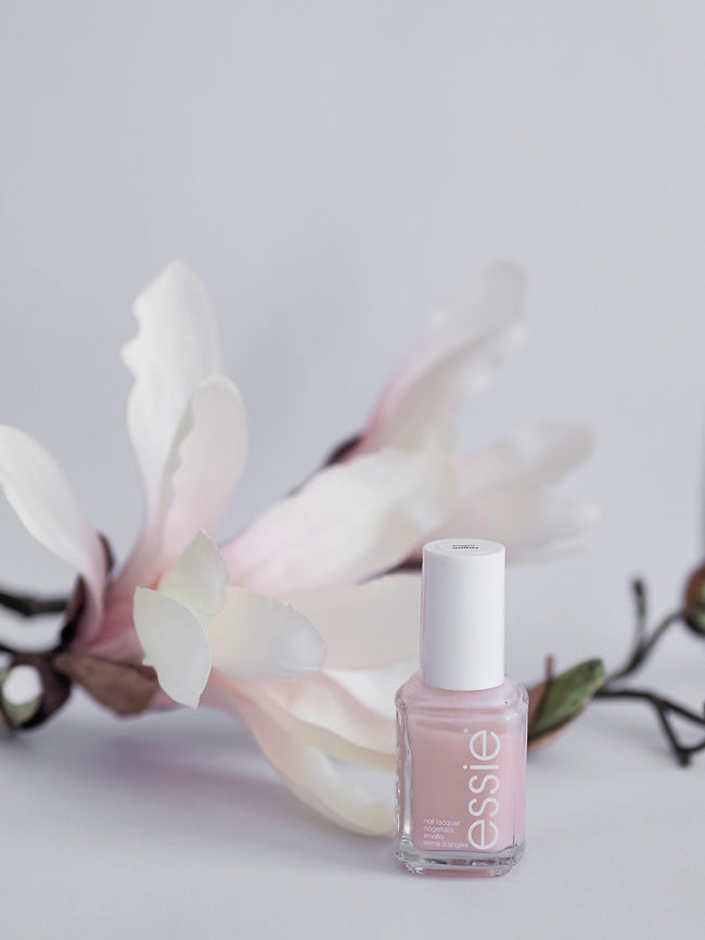 Nail polish bottle with pink polish to show that makeup and cosmetics products like this are hazardous to ship. 